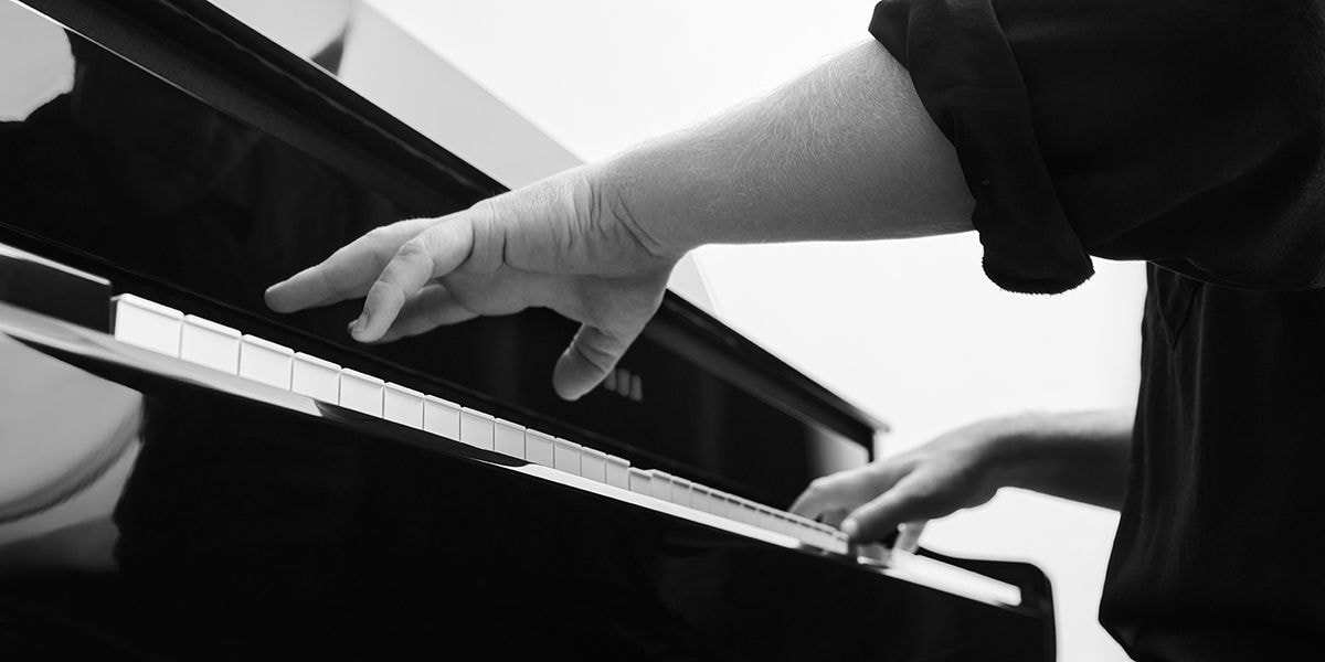 A person playing Yamaha Clavinova CLP-875PE