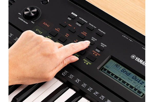 A person pushing the Quize mode button